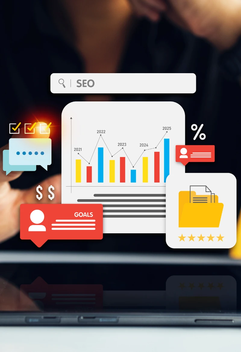 A digital illustration showing SEO-related graphics on a laptop screen. The image includes a search bar with 'SEO,' a graph with 2021-2025 data, chat icons, dollar signs, a 'GOALS' label, folders with stars, and percentage indicators. The background is blurred, focusing on the visuals and laptop.